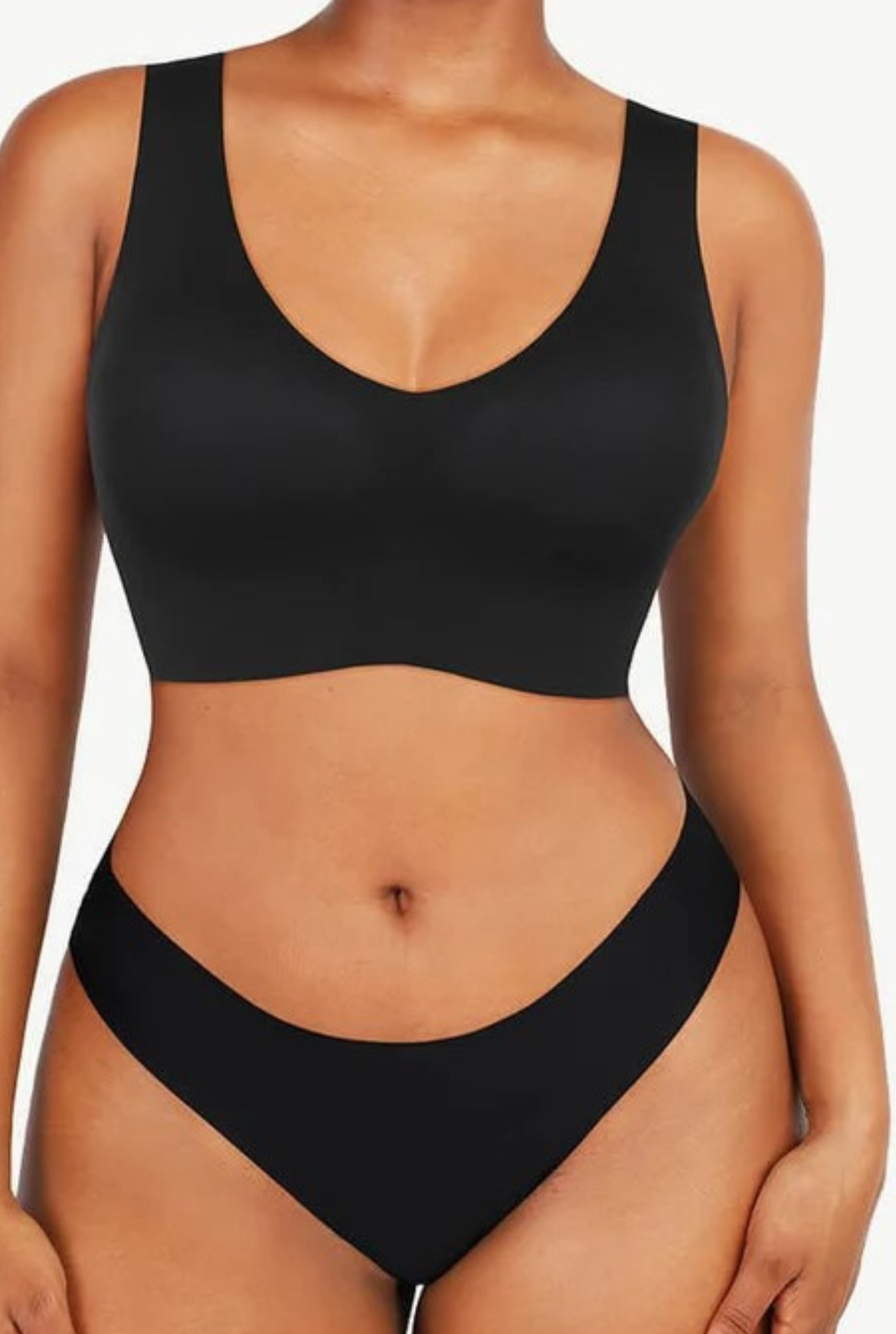 A model wearing a black Flawless V-Neck Shaper Bralette with a V-neckline and thin straps.